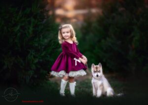 little girl with husky puppy