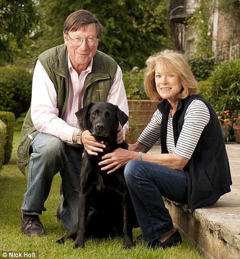 Faithful friend: Max Hastings with his wife Penny and their labrador Stanley - who cost his owners a small fortune in vet
