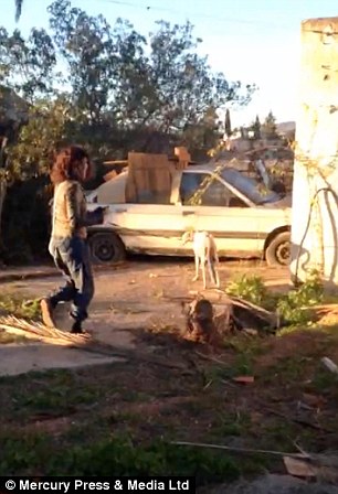 Lianne Powell is pictured here being led by Vera to the abandoned car where her puppies lay